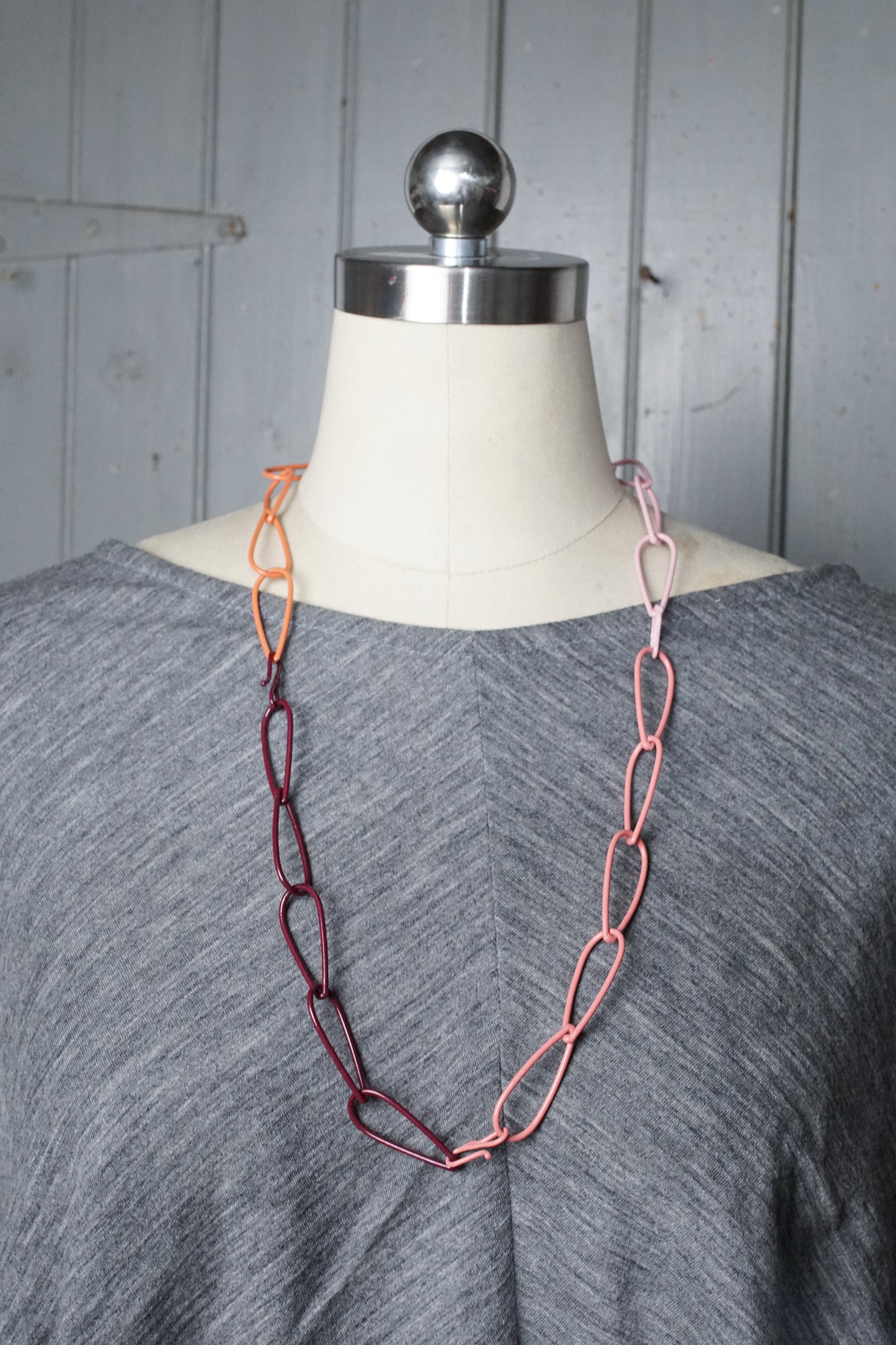 long Modular Necklace in burgundy, coral, and pink