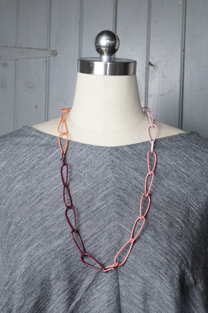 long Modular Necklace in burgundy, coral, and pink