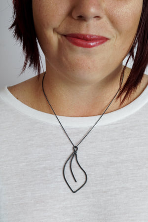 Flourish Necklace in black steel, silver, or bronze