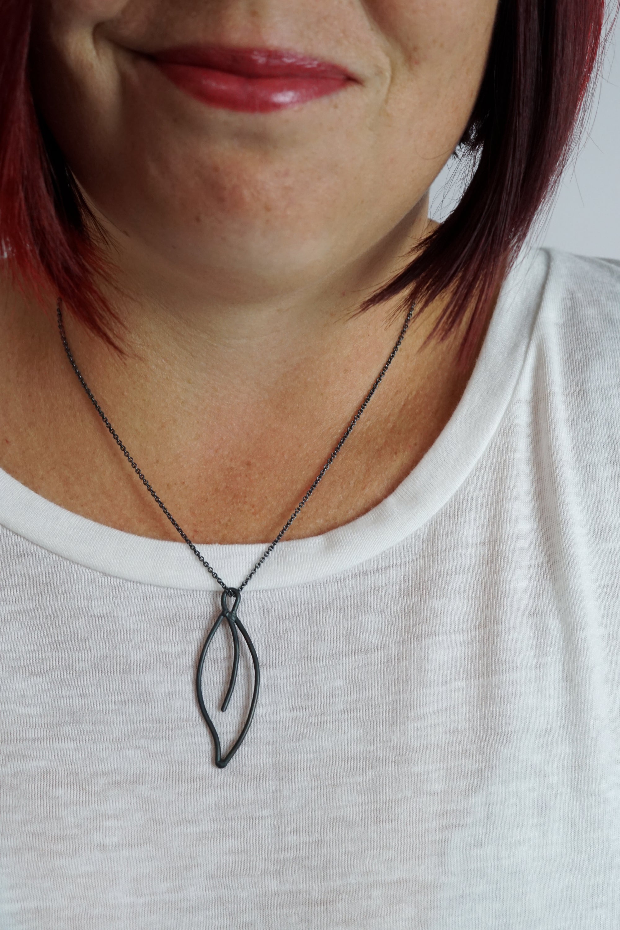 Replier Necklace in black steel, silver, or bronze