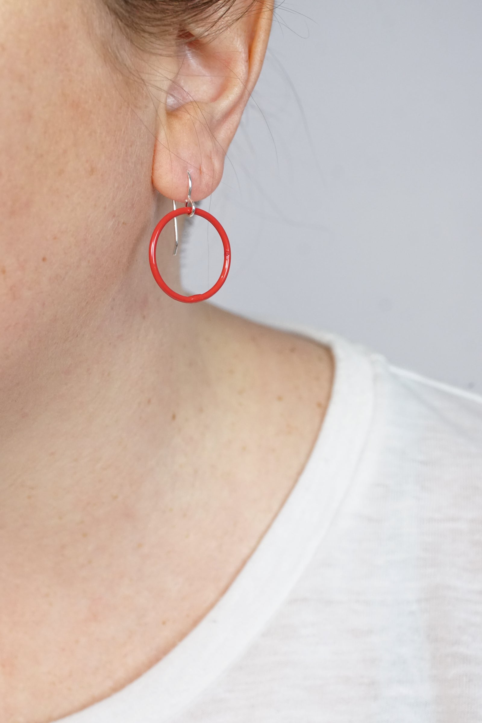 Small Evident Earrings in Coral Red