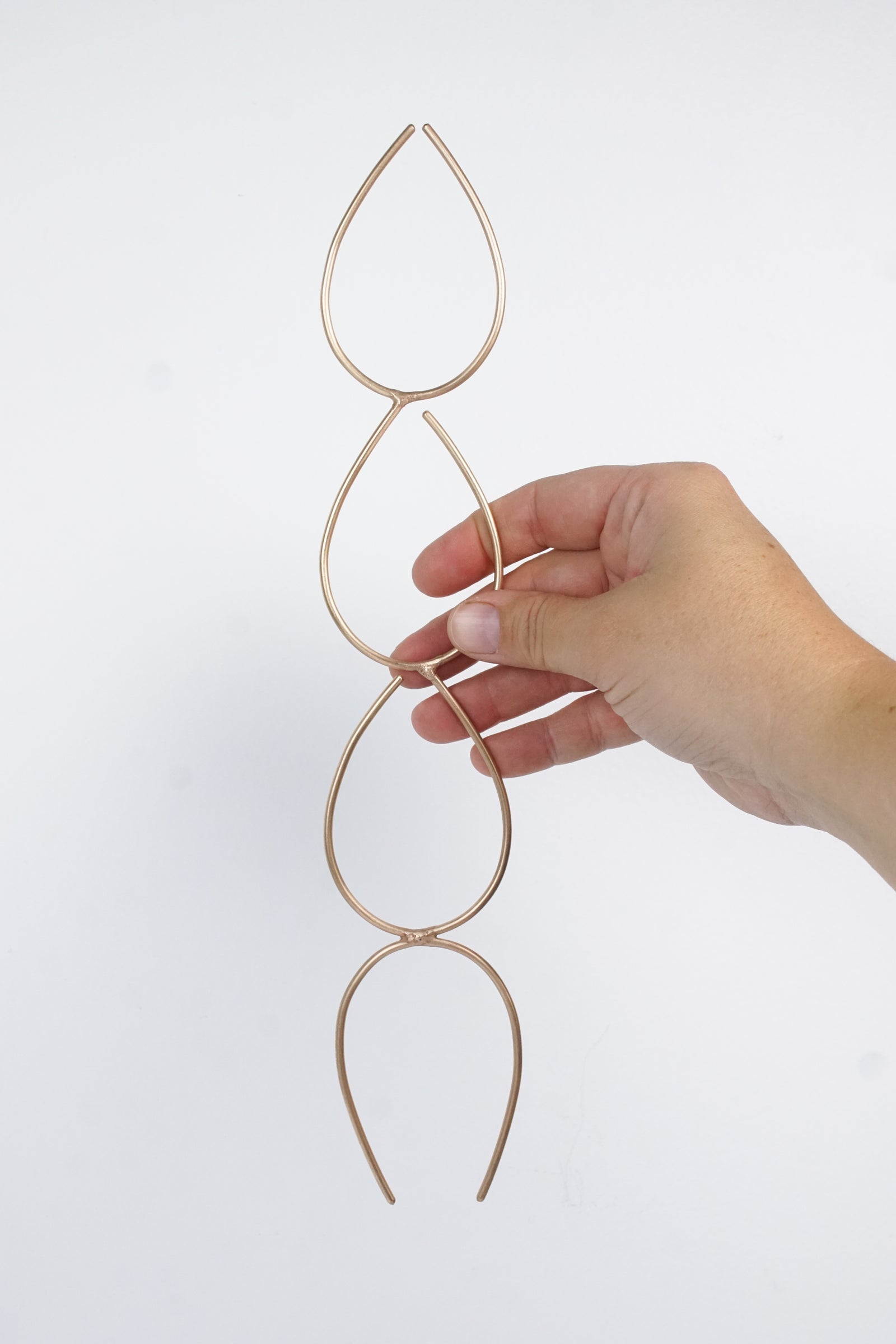 handcrafted bronze plant stake indoor trellis with philodendron silver sword plant